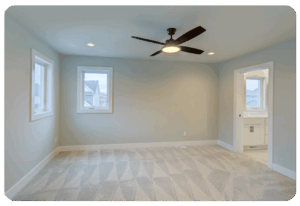 grey carpeting in empty bedroom shows vacuum marks 