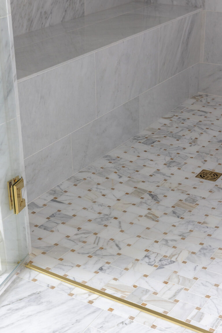 walk in shower floor marble tile with metallic gold details