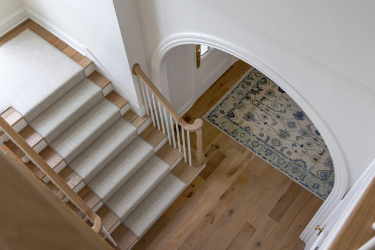 grey carpet stair runner with hardwood floor
