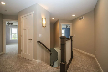 upper level carpeted hallway