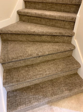 brown carpet staircase