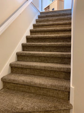 brown carpet staircase