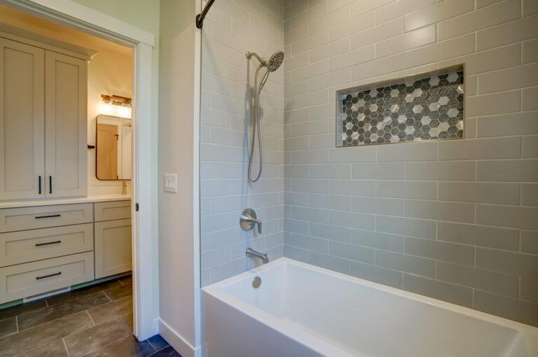 grey tile shower with niche