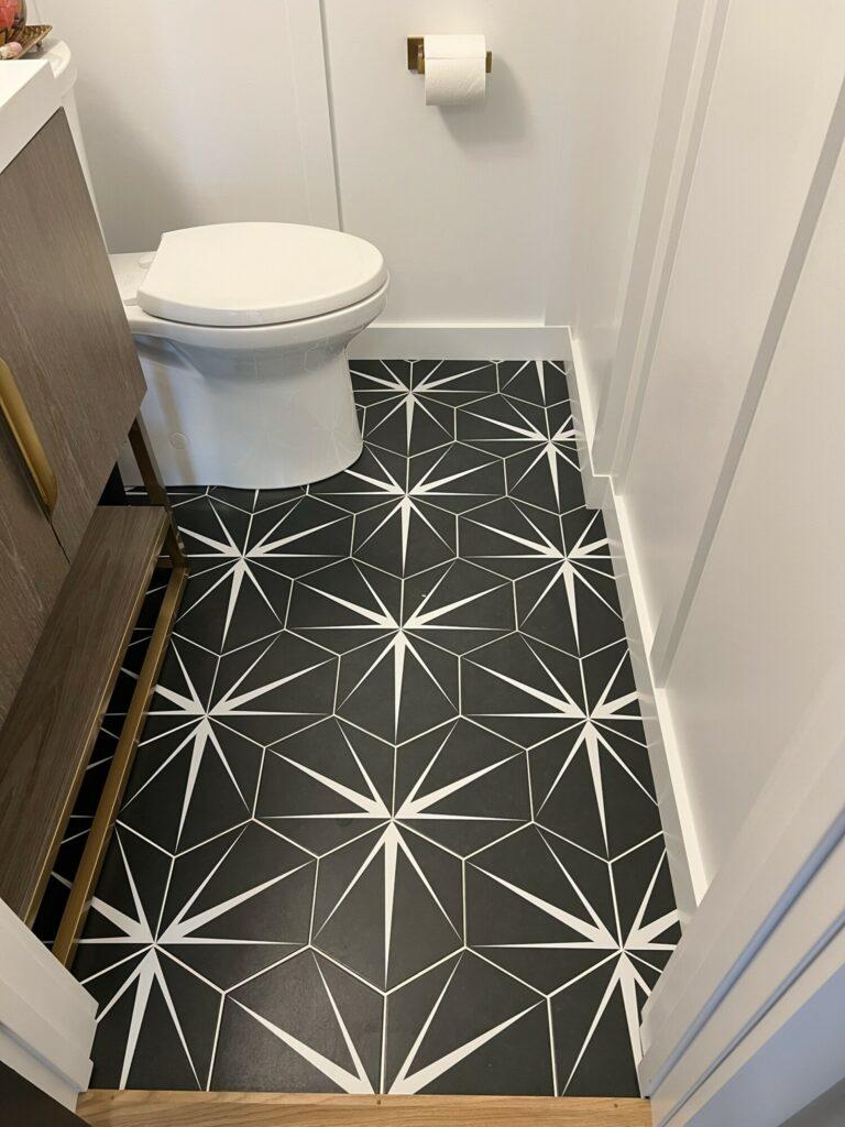 black and white powder room floor hexagon tile