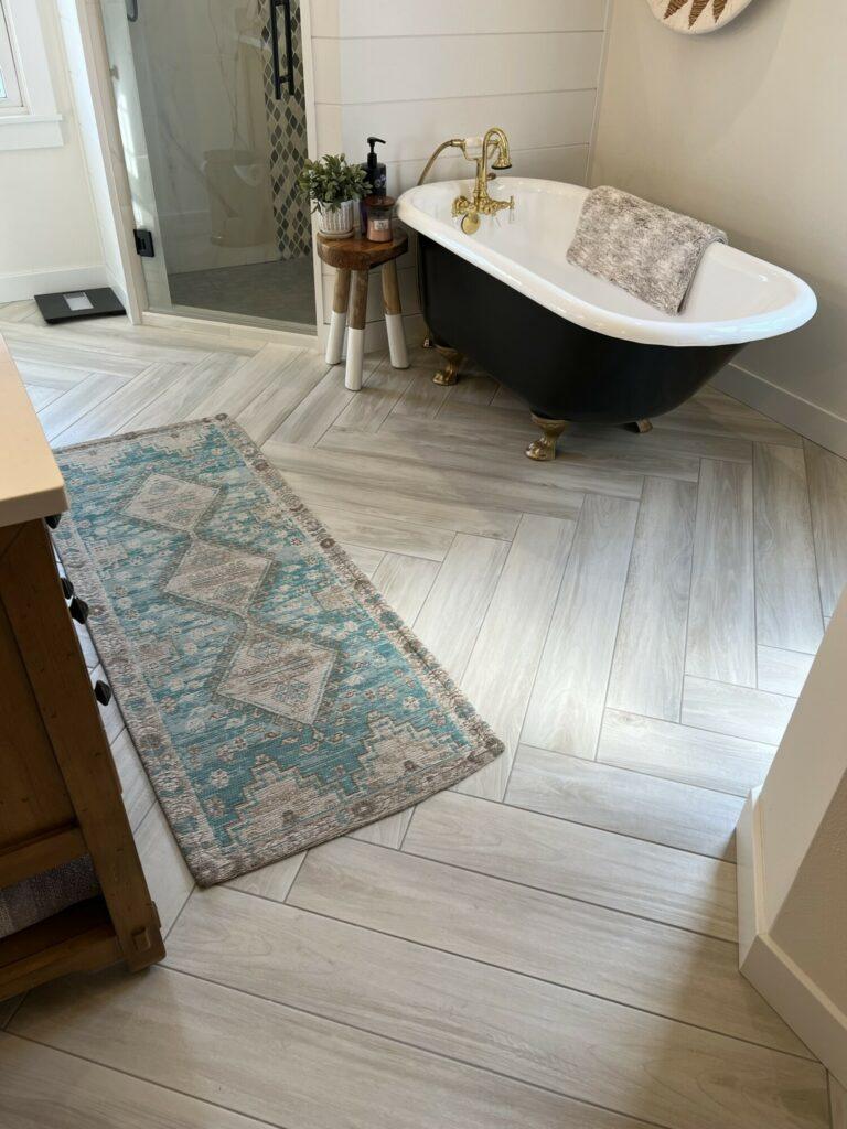 herringbone tile floor bathroom