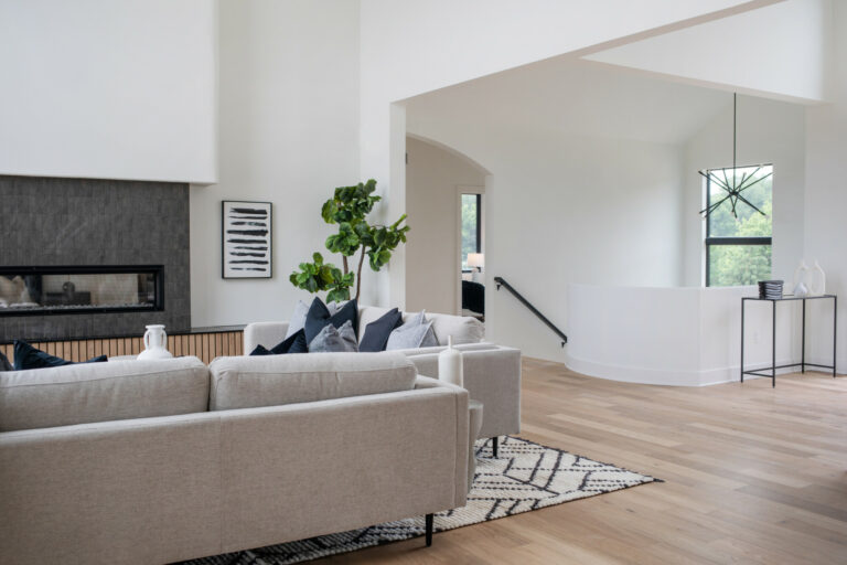 grey tile fireplace surround hardwood floor living room