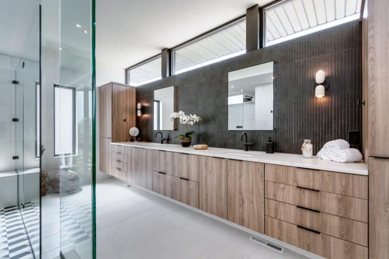 black tile primary bathroom backsplash