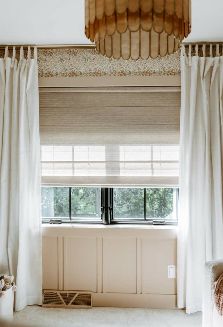 Custom hunter douglas window treatments with black out shades for a nursery in blush pink