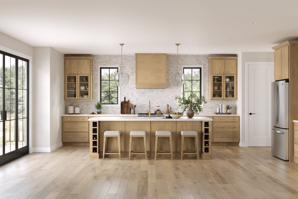 pale wood color custom kitchen cabinets with wood floors cabinet to ceiling tile backsplash