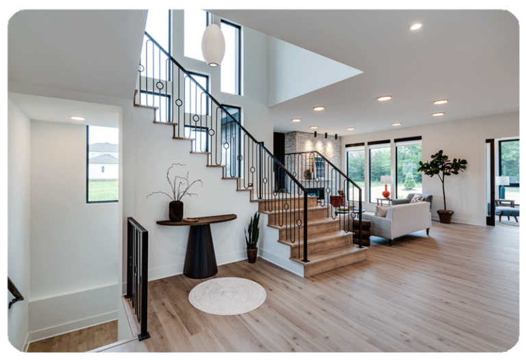 luxury vinyl plank flooring wood look finish on the main floor with a staircase leading up