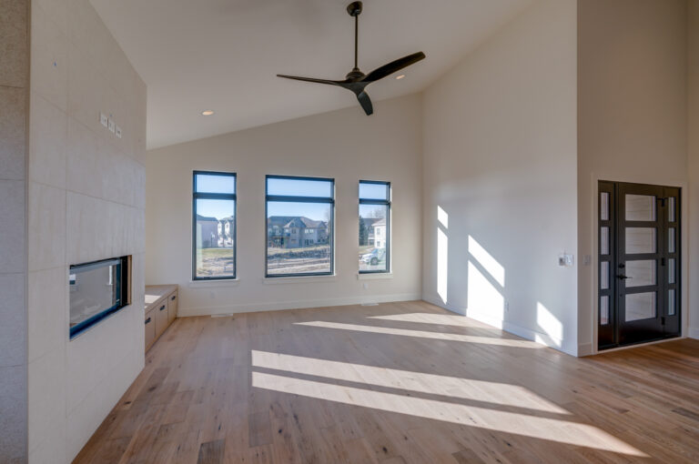 Hardwood floor white walls and fireplace