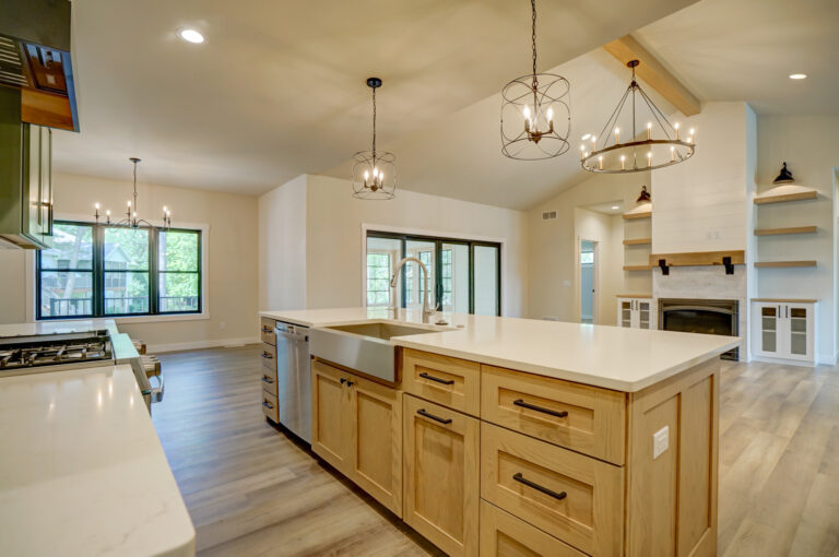 kitchen view of island and wood look luxury vinyl plank flooring