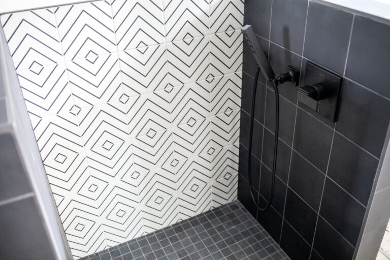 white and black tile dog shower