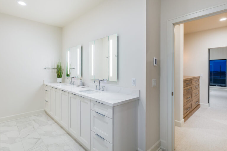 white batrhoom white marble tile floor white vanity