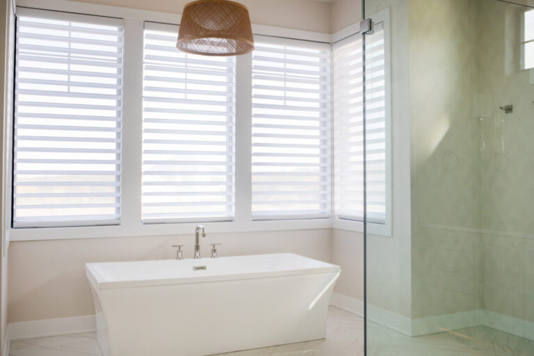 white free standing tubs white marble tile floor