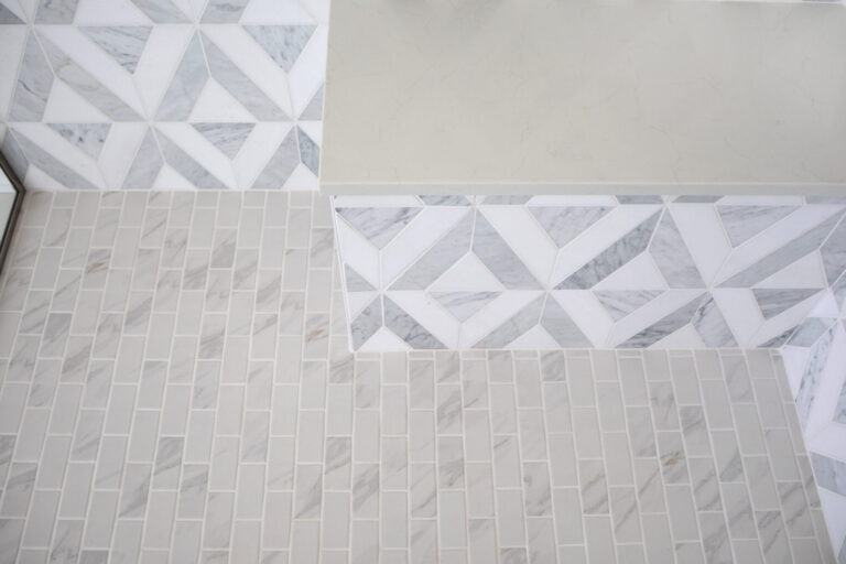 walkin curbless shower stone tile floor with built in bench