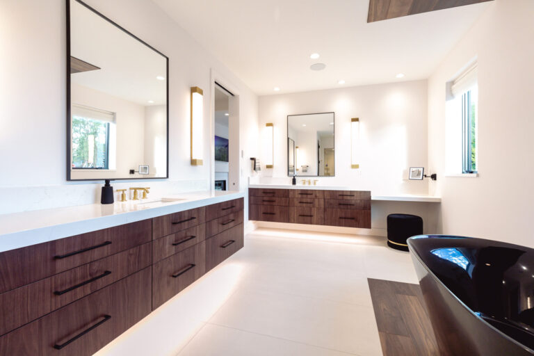 two dark wood floating vanities white tile floor