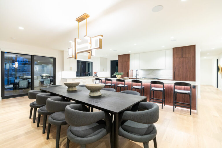 view of dining room table and kitchen white oak hardwood floor,