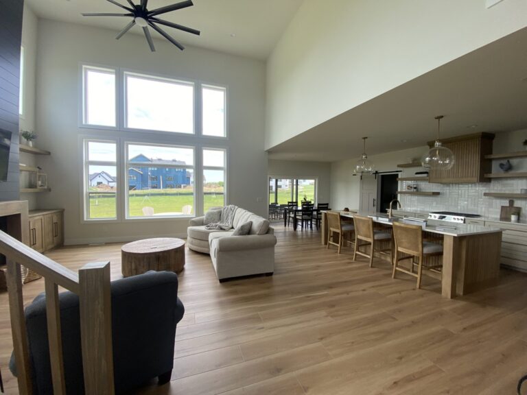 luxury vinyl plank wood look flooring in a living room with a wall of windows