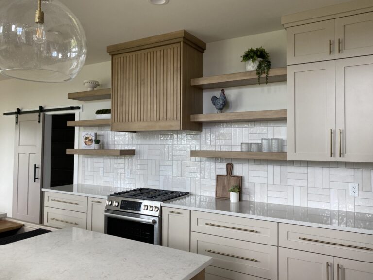 view of kitchen cabinets with open shelves wood stove hood and white textured tile backsplash