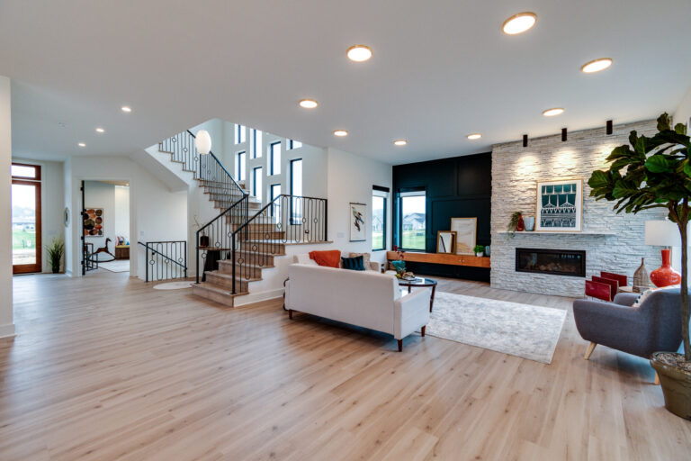 luxury vinyl wood look plank in living room with white couch and area rug