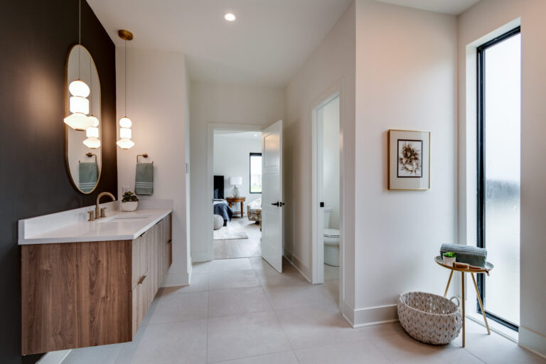 white tile floor with floating wood vanity and white countertop