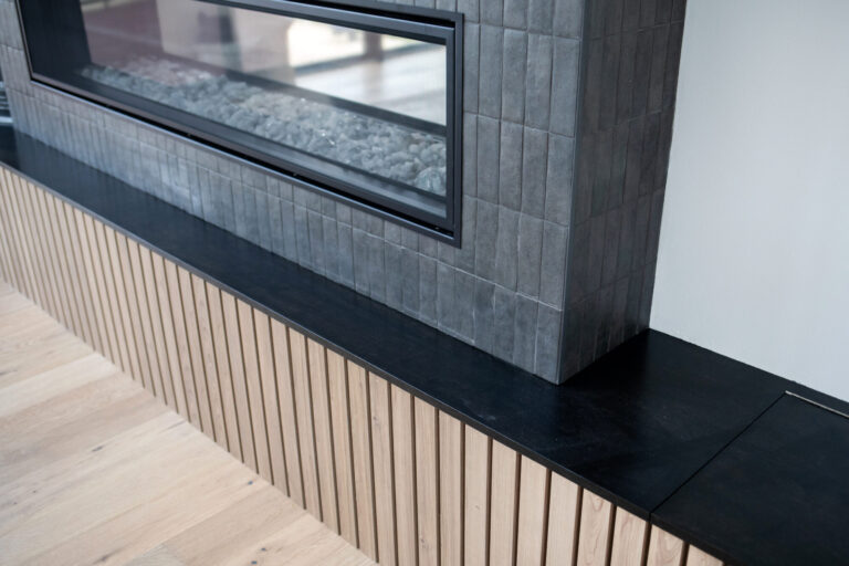 close up of fireplace with grey tile surround