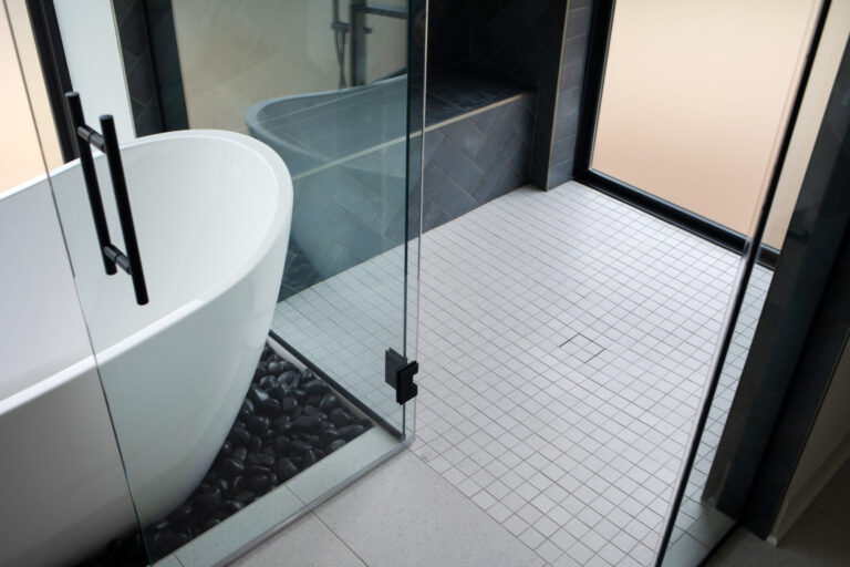 white tile floor standing tub glass enclosure slate gray tile wall