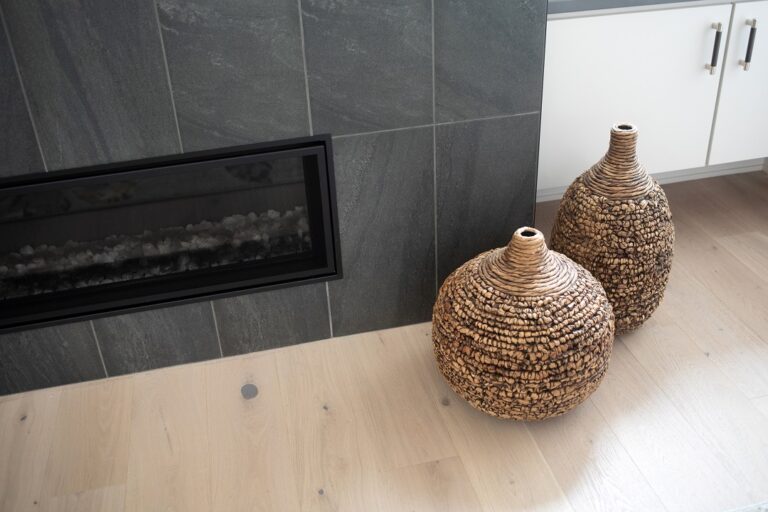 white oak hardwood floor with grey tile fireplace