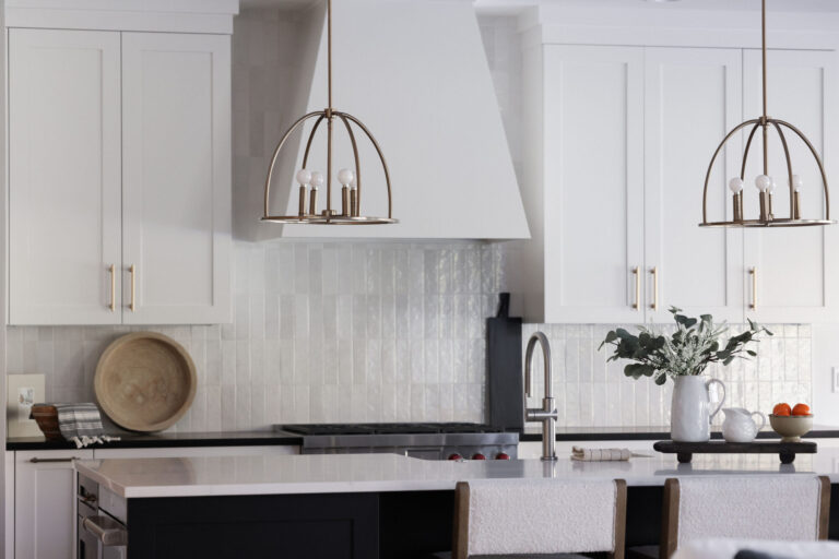 kitchen with white tile backsplash and white cabinets