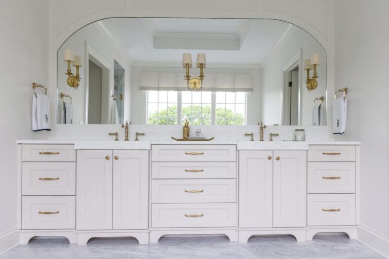 white marble tile floor under white double vanity