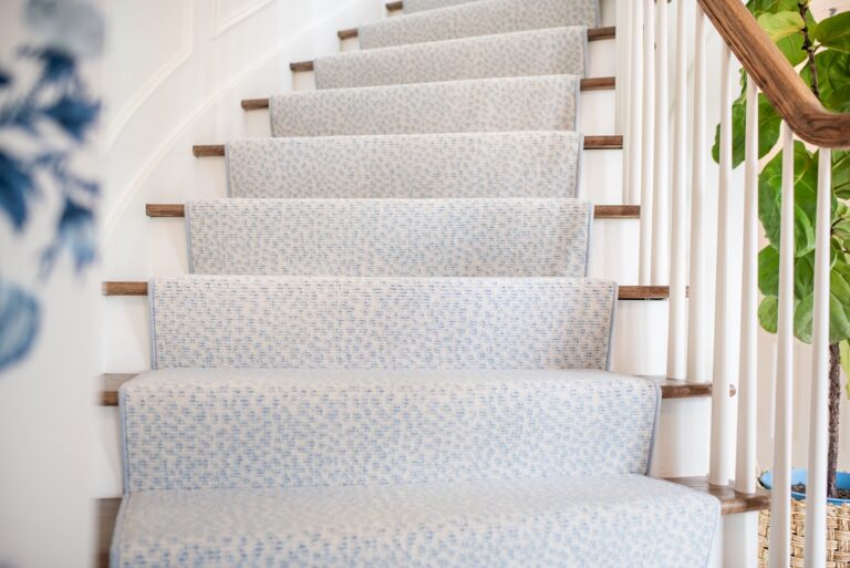 blue pattern carpet stair runner curved stair case