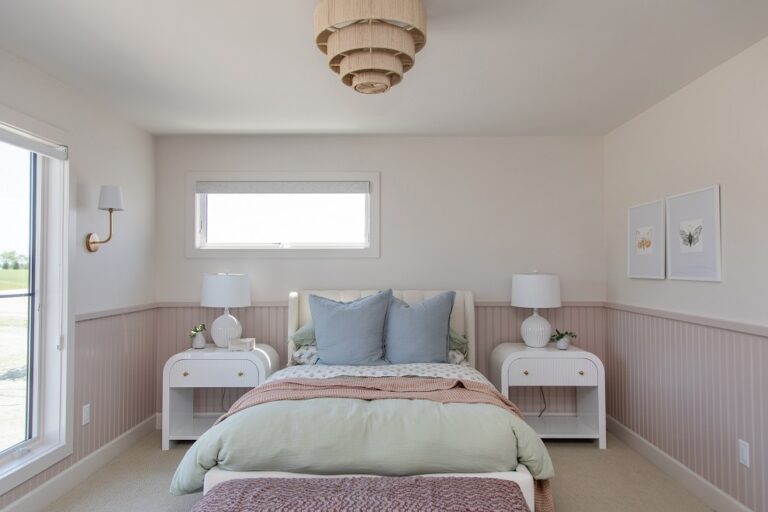 bedroom with queen bed and two night tables wall to wall carpeting