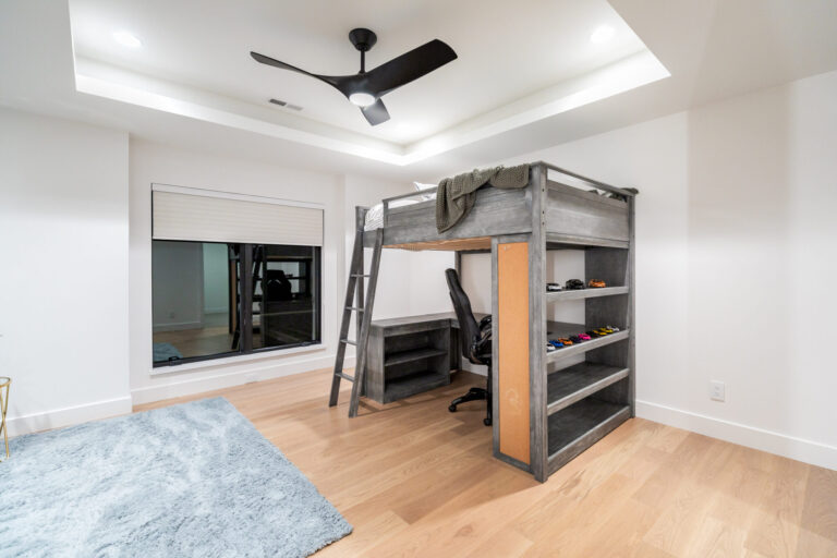 bedroom with bunk beds light white oak floors and white painted walls