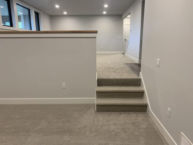 lower level wall to wall carpeting with steps and carpeting