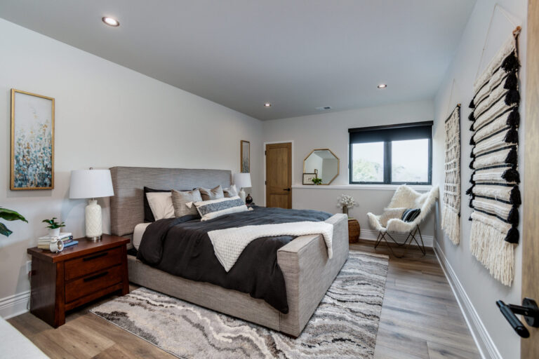 bedroom with luxury vinyl plank flooring area rug and queen size bed