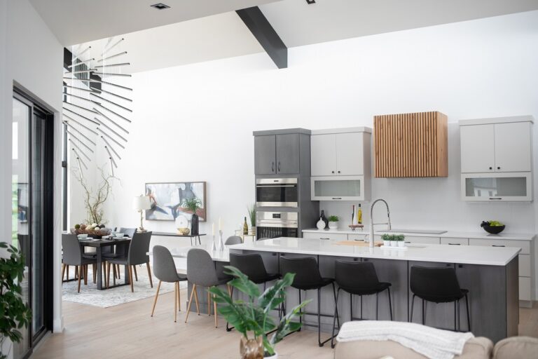 kitchen with grey and white island hardwood floors white oak and grey and white cabinets