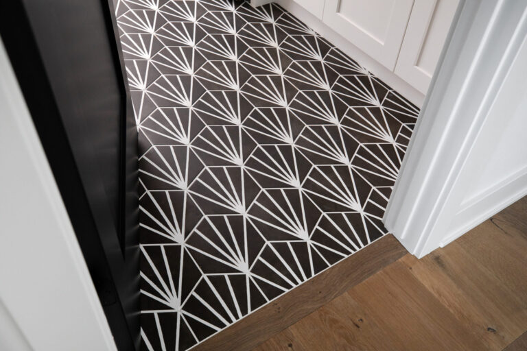 black and white hexagon tile floor in laundry room