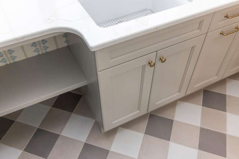 brown and ivory checkerboard tile floor laundry room