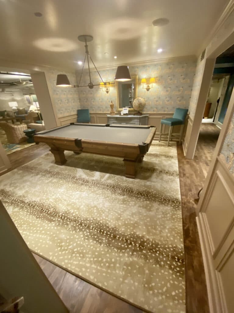madcap lounge milwaukee billiard room with a animal print pattern area rug under pool table