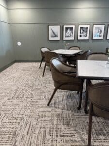 beige and brown carpet tile flooring in a meeting room in a senior living facility