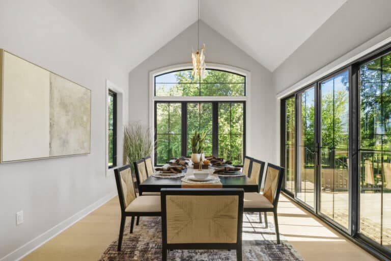 long dining with one wall of windows and white oak hardwood flooring