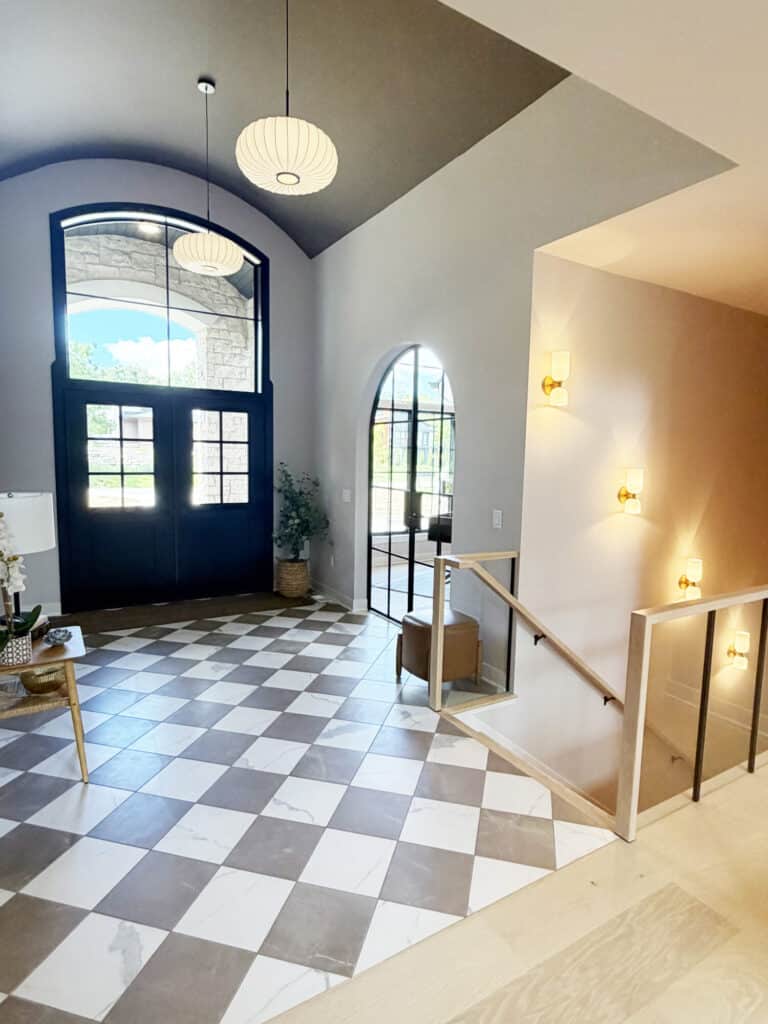checkerboard tile floor in the front entry way brown and cream color