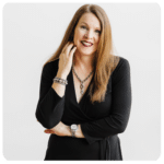 Kelly Kuehn headshot in black blazer