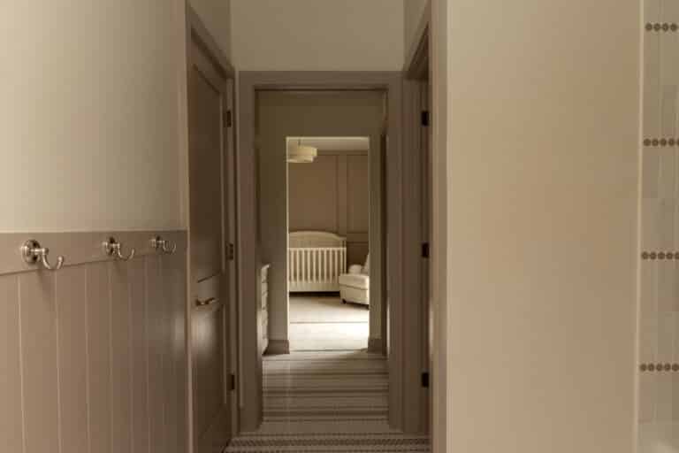tile floor hallway leading to a bedroom