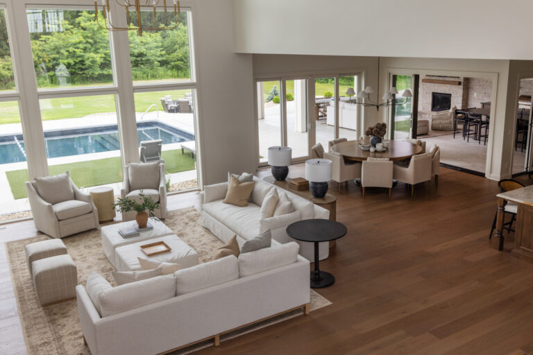 hardwood flooring in an open concept living room and dining area