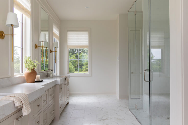 primary bathroom with marble tile floor and shower glass enclosure