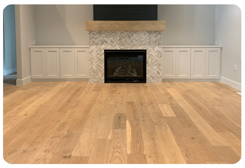 Wide-plank oak hardwood floor by a fireplace in a Milwaukee living room