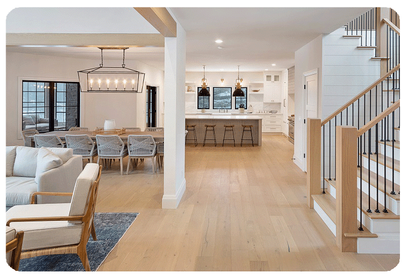hardwood flooring in main living area with couch and kitchen visible