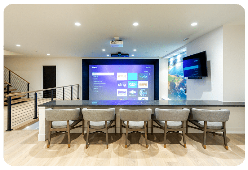 Finished lower level with basement-friendly flooring from a FLOOR360 project